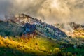 Beautiful scenery landscape Romania Magura Pestera village mountains hills fields foggy morning Royalty Free Stock Photo