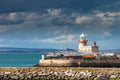 Sunset over lighthouse in Howth, Dublin, Ireland Royalty Free Stock Photo