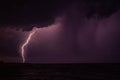 Beautiful scenery of lightning over the stormy sea at night Royalty Free Stock Photo