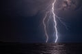 Beautiful scenery of lightning over the stormy sea at night Royalty Free Stock Photo