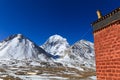 Beautiful North face of sacred Kailash mountain with old red brick building in foreground Royalty Free Stock Photo