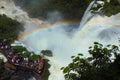 Beautiful scenery of rainbow at Iguacu Iguazu falls bridge with people close to waterfall border of Brazil and Argentina Royalty Free Stock Photo