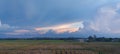 Beautiful scenery of rice paddy field under a cloudy sky in Nueva Ecija, Philippines