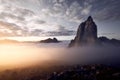 Beautiful scenery of rocky cliffs by the sea under a breathtaking cloudy sky at sunset Royalty Free Stock Photo