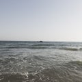 Beautiful scenery of splashing sea waves on a sunny day Royalty Free Stock Photo