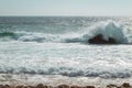 Beautiful scenery of splashing sea waves under a bright sky Royalty Free Stock Photo