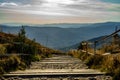 Beautiful scenery of a stairs trail in hills landscape on a cloudy day in Poland