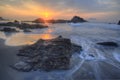 Beautiful scenery of sunrise by the rocky seashore