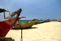 traditional fisherman boats on sandy beach. bright sunny day and blue sky background Royalty Free Stock Photo