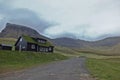 Beautiful scenery with typical house with grass roof Gasadalur village Goose valley. Faroe Islands Royalty Free Stock Photo