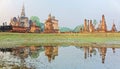 Beautiful scenery of Wat Mahathat Temple in Sukhothai Historical Park, Thailand, with view of a Buddha statue seated