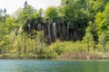 Beautiful scenery of waterfalls with vegetation and a lake at Plitvice Lakes National Park Royalty Free Stock Photo