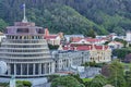 Beautiful scenery of Wellington city buildings surrounded by tall green trees in the morning