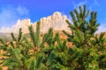 Beautiful scenic autumn landscape of majestic Bolshoy Tkhach rocky mountain peak under blue sky on sunny day with fir tree conifer