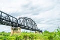 Beautiful scenic of black steel railway bridge across the river Royalty Free Stock Photo