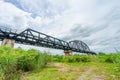 Beautiful scenic of black steel railway bridge across the river Royalty Free Stock Photo