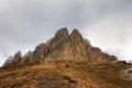 Beautiful scenic dramatic autumn landscape of majestic Bolshoy Tkhach rocky mountain peak under cloudy sky. Caucasus, Russia