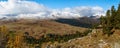 Beautiful scenic dramatic sunny golden autumn panoramic landscape of Caucasus mountains with blue sky and clouds. Sunset on Azishs