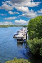 Beautiful scenic dutch lake, yacht harbour, green forest, blue summer sky - Leukermeer, Netherlands