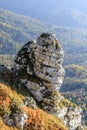 Beautiful scenic golden autumn vertical landscape of mountain rock at sunset. Chernogor Mount, West Caucasus, Russia Royalty Free Stock Photo