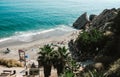 Beautiful scenic landscape. Aerial view of a beach in Nerja from the top viewpoint. Great touristic place for lazy vacation.