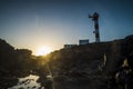 Beautiful scenic landscape with classic lighthouse and golden sunset in background - concept of travel and scenic place. for Royalty Free Stock Photo