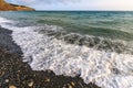 Beautiful scenic landscape of stony beach at Black Sea coast by Anapa, Russia. Wave splashing on the shore making spindrift. Royalty Free Stock Photo