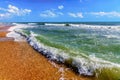 Beautiful scenic landscape of surfing waves splashing with spindrift on sandy seashore of stormy Black Sea at Blaga Beach of Anapa