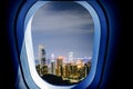 Beautiful scenic night city view through the aircraft window