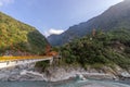 Beautiful scenic of the pagoda in the mountain with the long bridge across the river