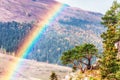 Beautiful scenic sunny golden autumn landscape of Caucasus mountains with lone pine tree and rainbow. Lagonaki highlands, Russia Royalty Free Stock Photo