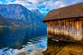 Beautiful scenic sunset over Austrian alps lake. Wooden boat house in alps in Hallstatt mountain village at the lake. Location: Royalty Free Stock Photo