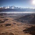 a beautiful scenic view of a barren valley against the background of a colorful ...