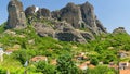 Beautiful scenic view of the Kalabaka town on top of the cliff. small houses with red roof. greece