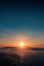Misty landscape in sunset with epic stars Royalty Free Stock Photo
