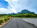 beautiful Scenic view of the mountain with leading line road with cloudy blue sky background Royalty Free Stock Photo