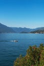 Beautiful scenic view of the white speedboat cruising along Lake Como, Italy. Royalty Free Stock Photo