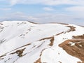 Beautiful scenic winter landscape from Carpathian Mountains in Romania. Lonely hiker