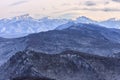 Beautiful scenic winter mountain landscape of Lagonaki mountain region with snowy peaks and forest valley. Bolshoy Tkhach mountain