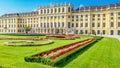 Beautiful Schonbrunn Palace with colorful flowerbed Vienna, Austria