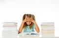 Sweet little schoolgirl feeling exhausted and stress by load of homework and schoolwork Royalty Free Stock Photo