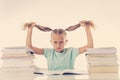 Beautiful school girl trying to study and is driving her crazy in motivation low performance children Royalty Free Stock Photo