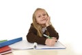 Beautiful schoolgirl in school uniform with blond hair smiling h Royalty Free Stock Photo