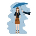 Beautiful schoolgirl stands happy in the rain. A man hands an umbrella to a young woman Royalty Free Stock Photo