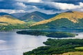 Beautiful Scottish Loch (Lake) with islands surrounded by mountains and a dramatic sky (Loch Lomond