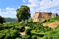 Sculpted gardens with house, Dordogne, France