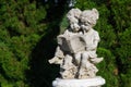Beautiful Sculpture of boy and girl reading book.