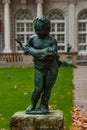 Beautiful sculpture of little kid with angry fish Royalty Free Stock Photo