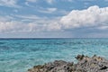 Beautiful sea and cloud landscape. Caribbean sea coast with turquoise water and stony beach