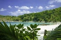 Beautiful sea lagoon. Exotic boats on transparent azure water, coast and tropical forest. Royalty Free Stock Photo